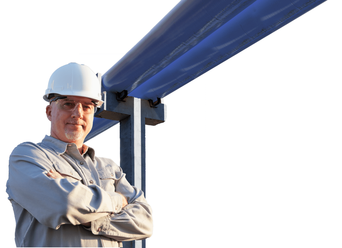 Worker in Front of Large Pipes