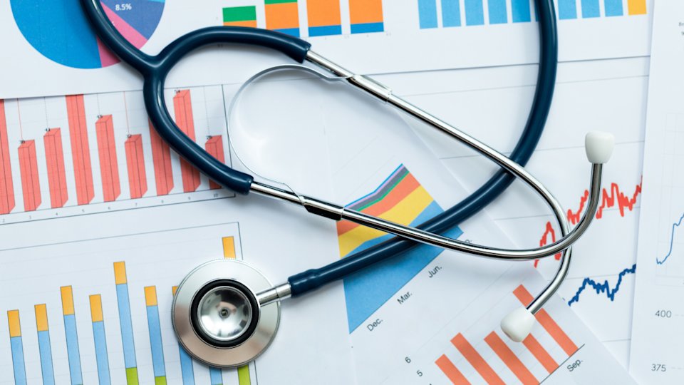 colorful charts of various types with a stethscope lying on top
