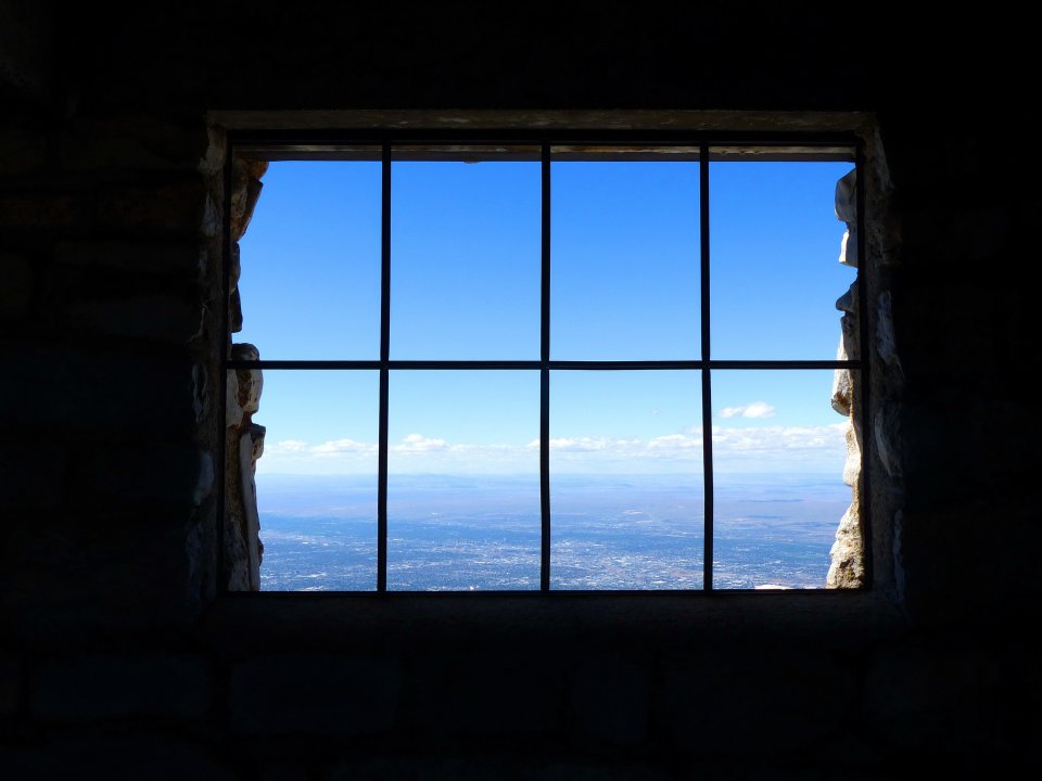 A large window overlooking a wide landscape.