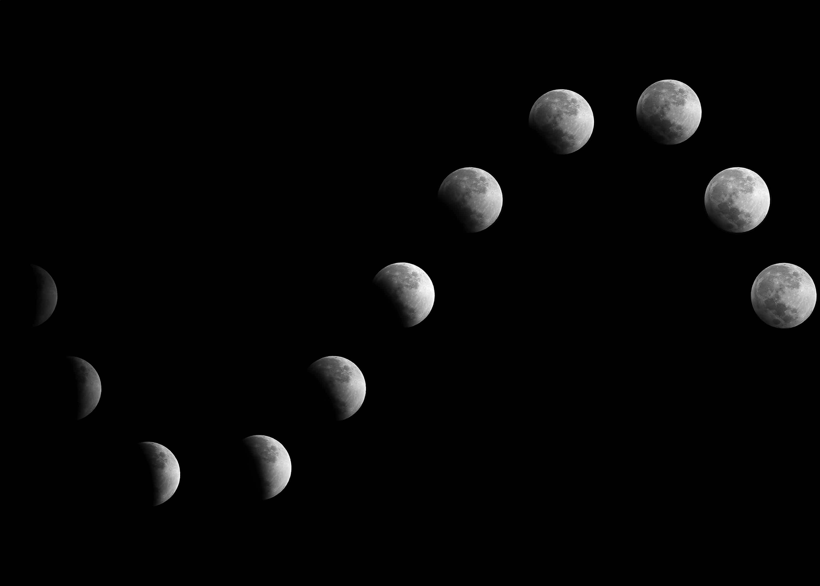 Photos of the moon in various phases superimposed into the same image