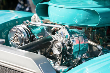 A photo of the engine bay of a turquoise car