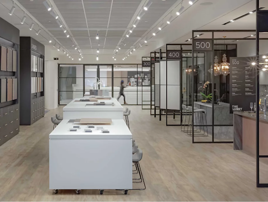 An marble counter and office desks inside of a Tridel Condo Show room