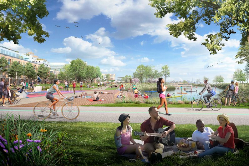 Group Picnicking on Grass Beside Multi-use Trail