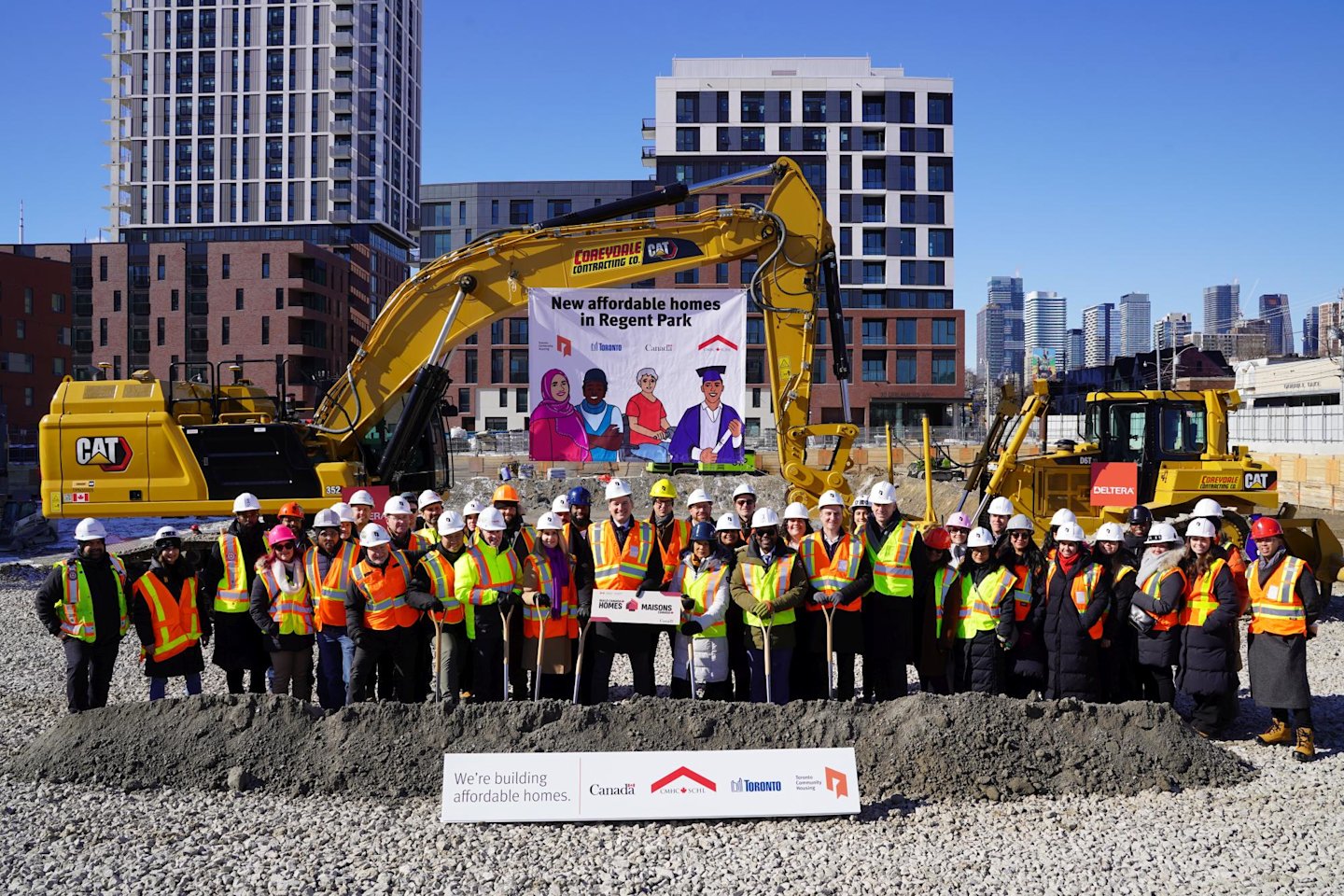 The groundbreaking event of Regent Park Phases 4 & 5 for more affordable homes, with everyone standing for a group photo.