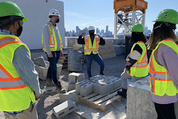 Construction team on rooftop