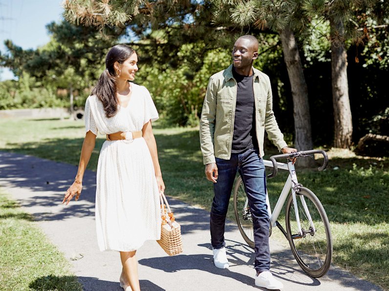 Couple walking through park path