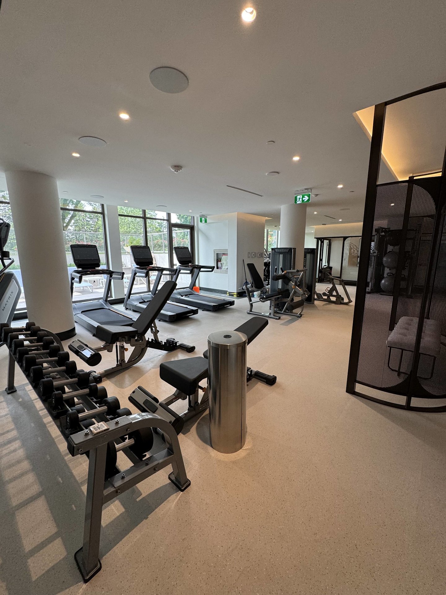 Royal Bayview gym featuring free weights, treadmills, stair climber, and static machine with a view facing the Ladies' Golf Club of Toronto.