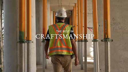Site super walking through construction site