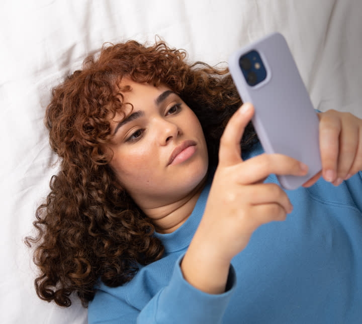 Woman on phone seeking bacterial vaginosis treatment