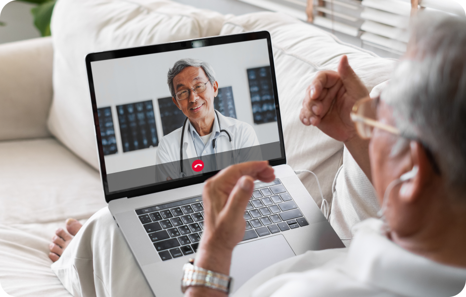 Senior man speaking with a provider on his computer