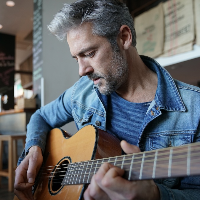 man playing guitar