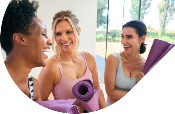 Women holding yoga mats