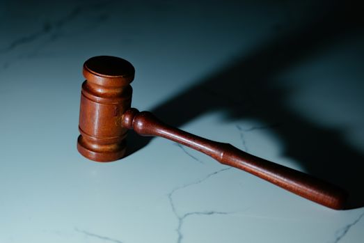 A gavel on a stone tabletop.