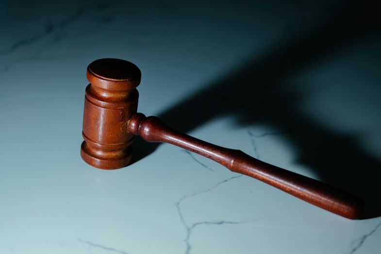 A gavel on a stone tabletop.