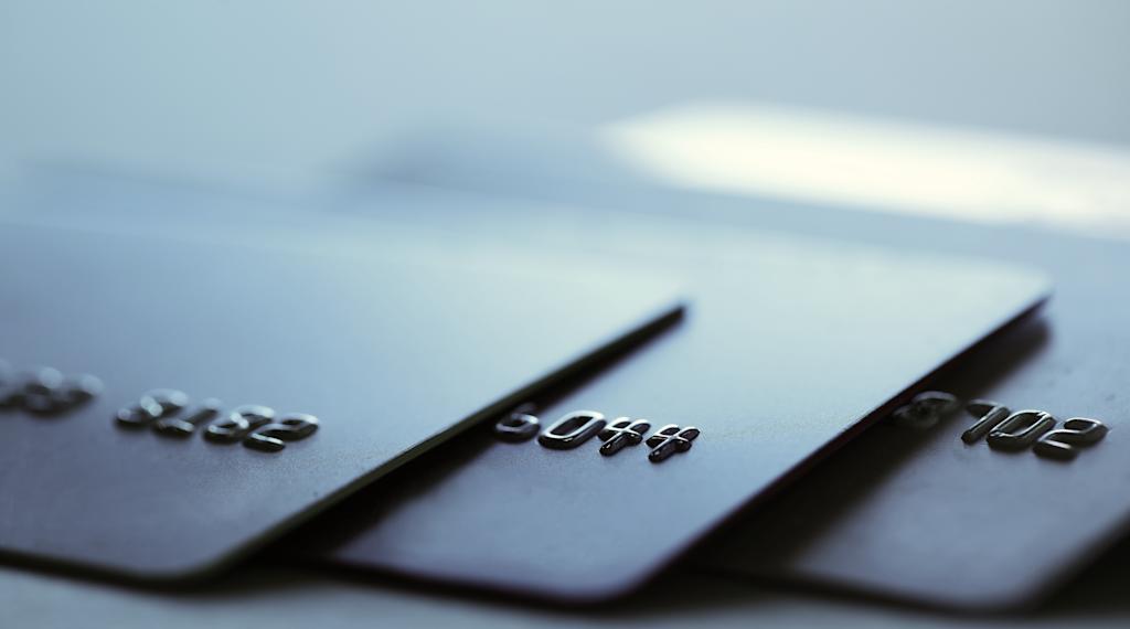 Many credit cards on blurred background, closeup
