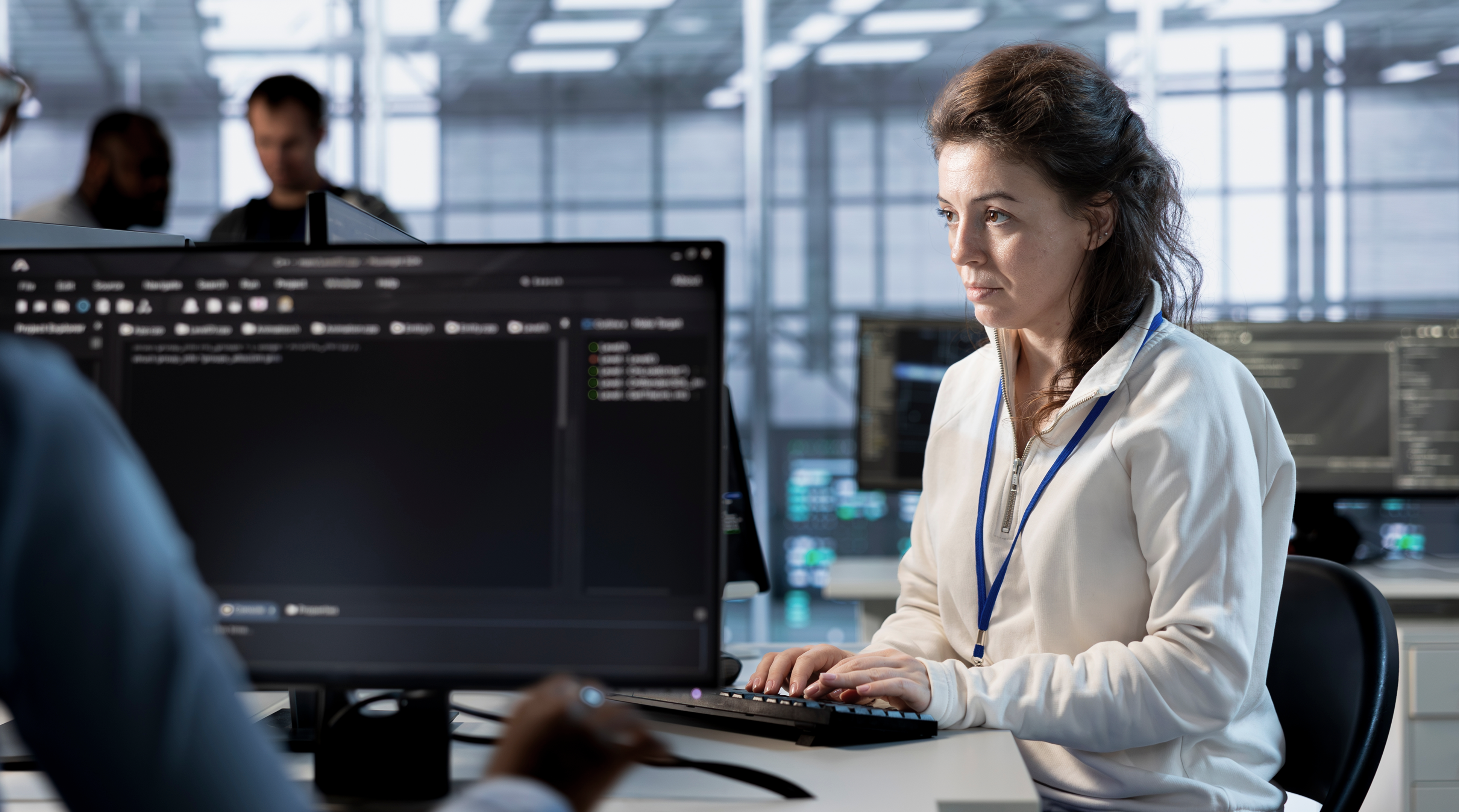Programmer at work implementing cybersecurity measures to protect data center. Server hub facility IT specialist monitoring and analyzing metrics with device to enhance operational effectiveness