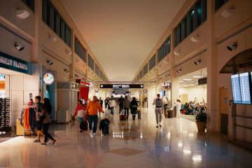 People walking around at the airport