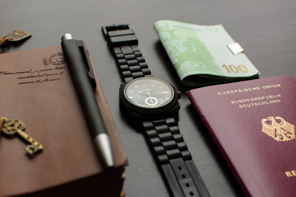 Travel documents money and watch