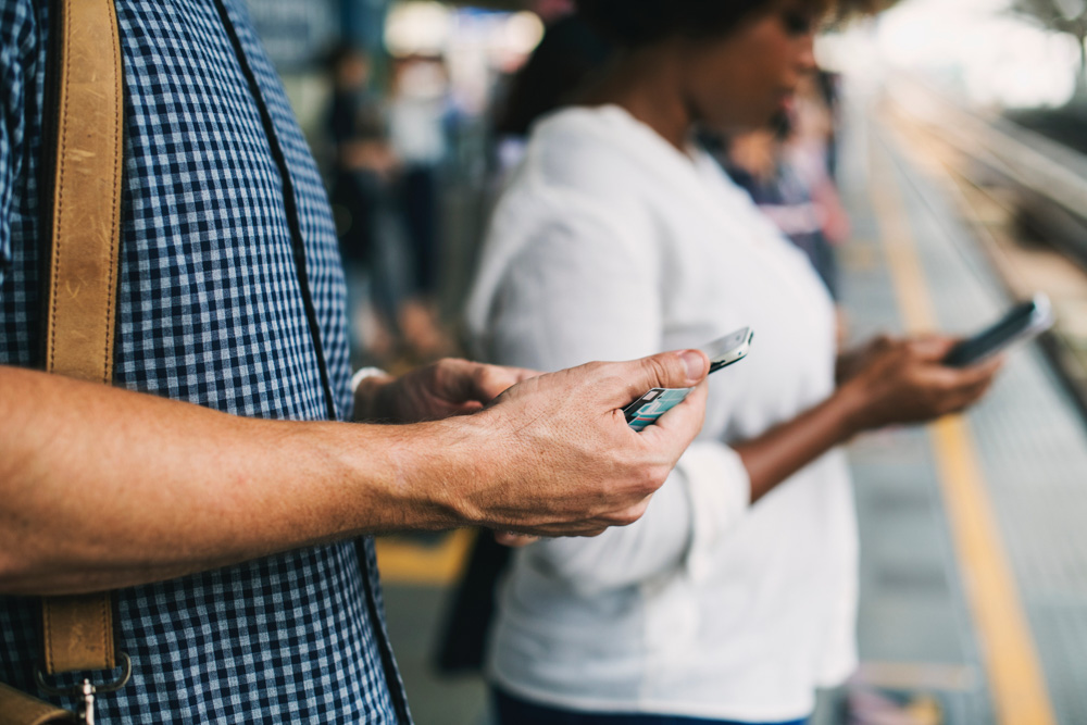 A man using a smartphone for stress-free travel
