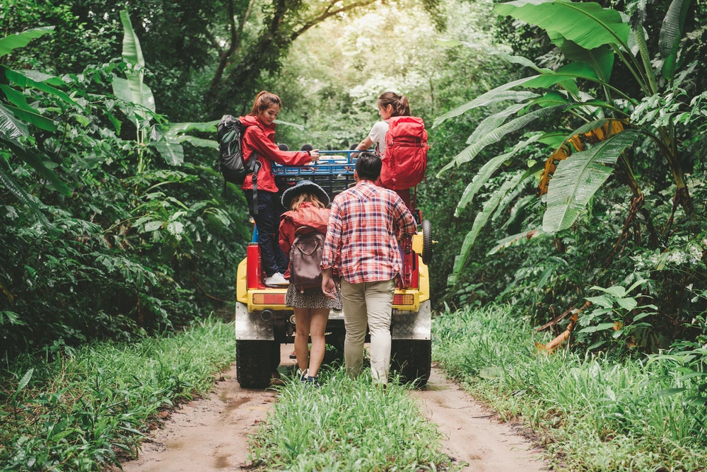 Jeep and people in the jungle