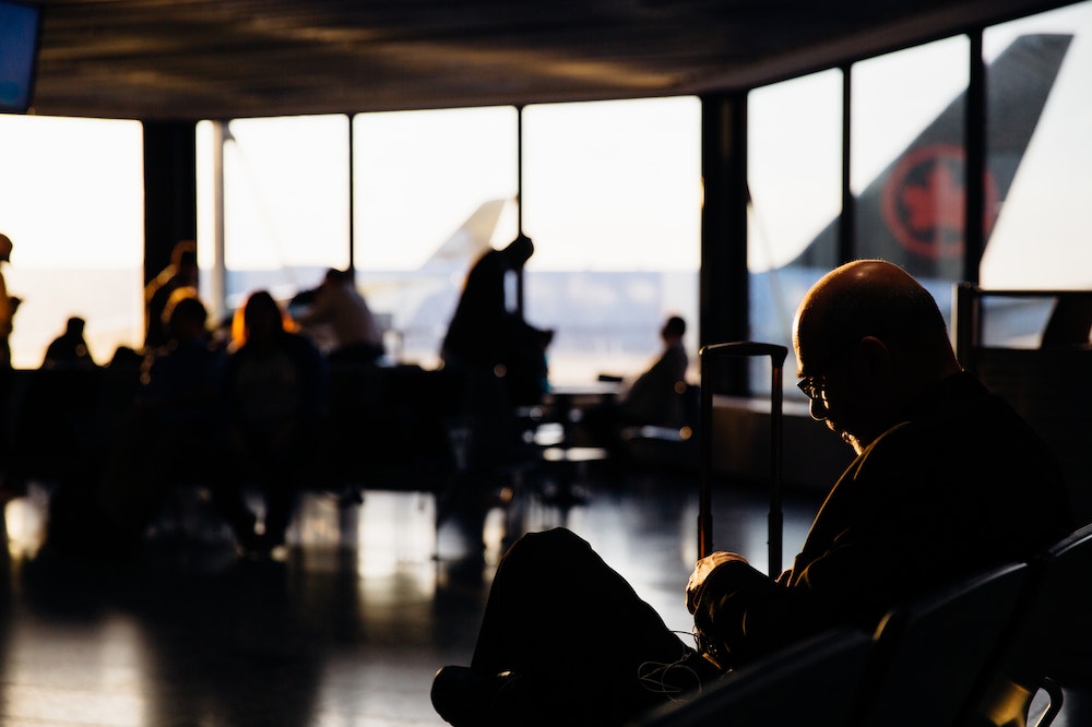 People waiting for their flight at a gate