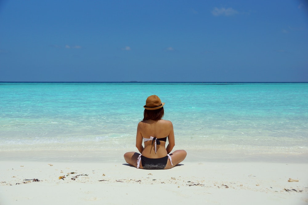 Woman sitting on the beach