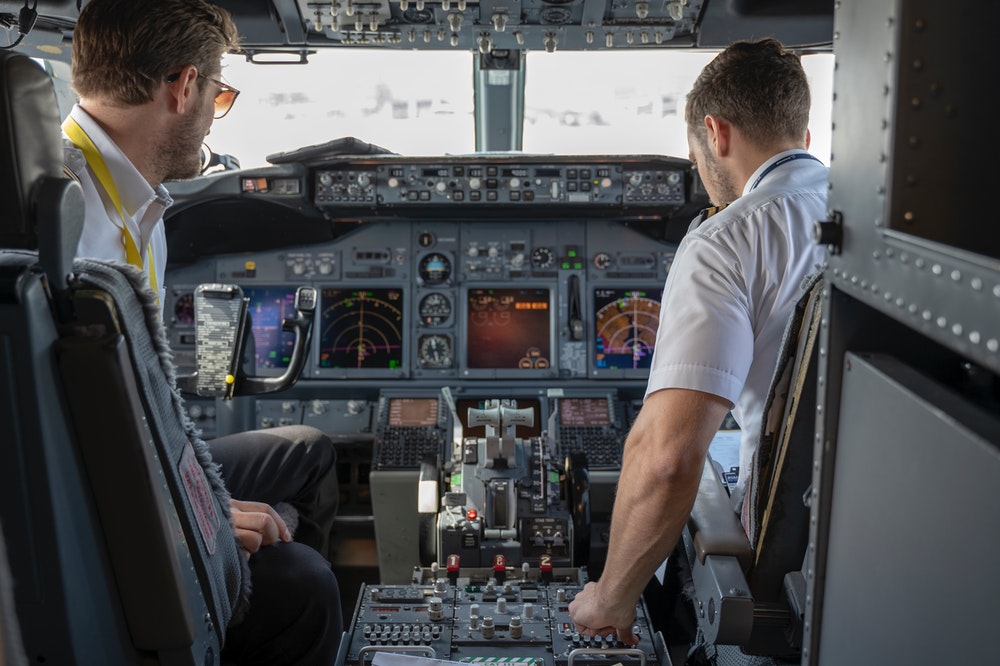 Two pilots on an airplane