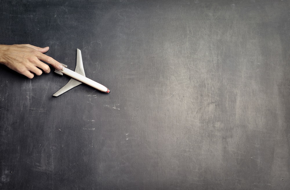 Holding a toy plane