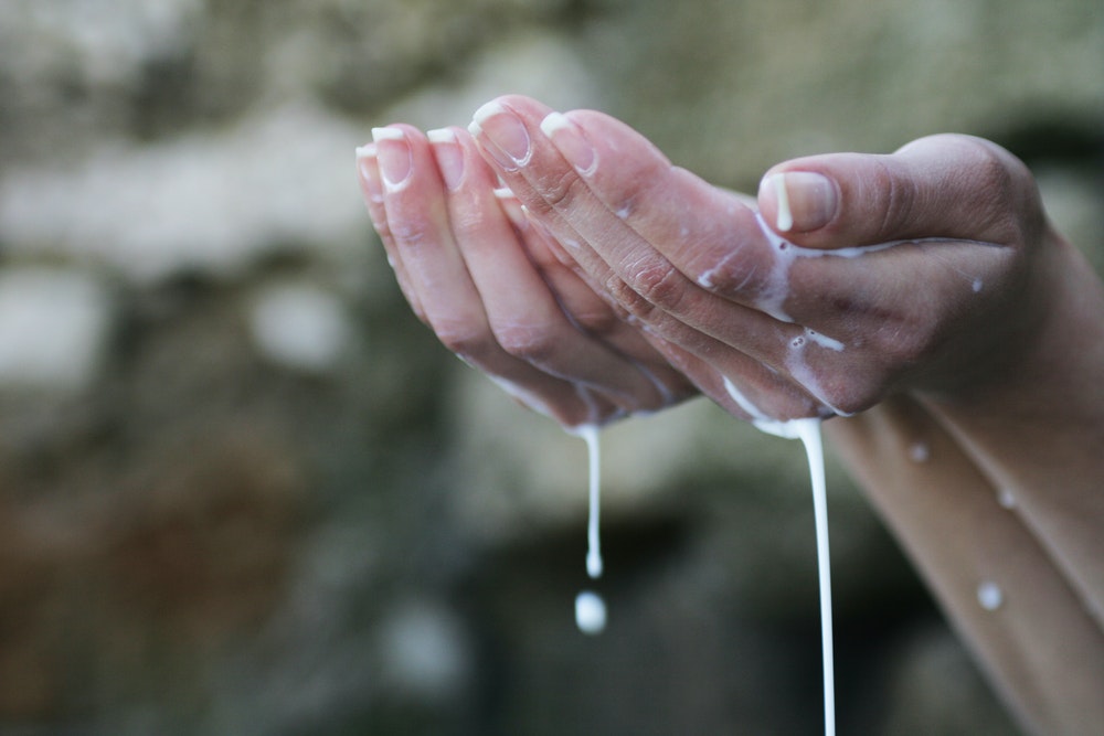 Washing hands with liquid soap