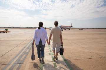 Couple walking to the airplane
