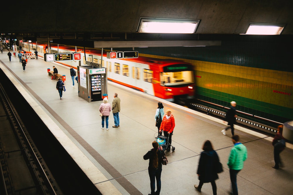 People on station platform waiting for their train