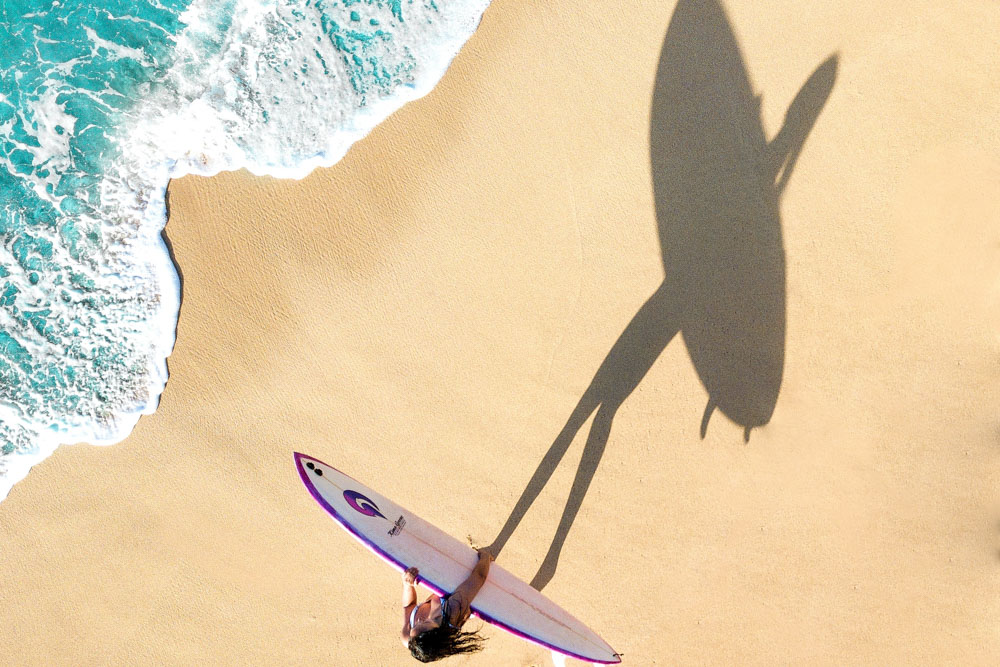 A surfer on the beach