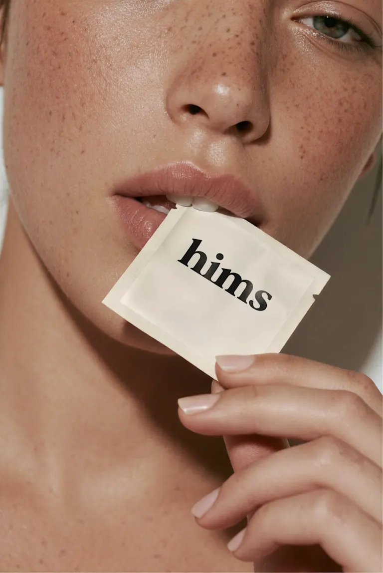 A women holds a PE treatment plan package to her mouth