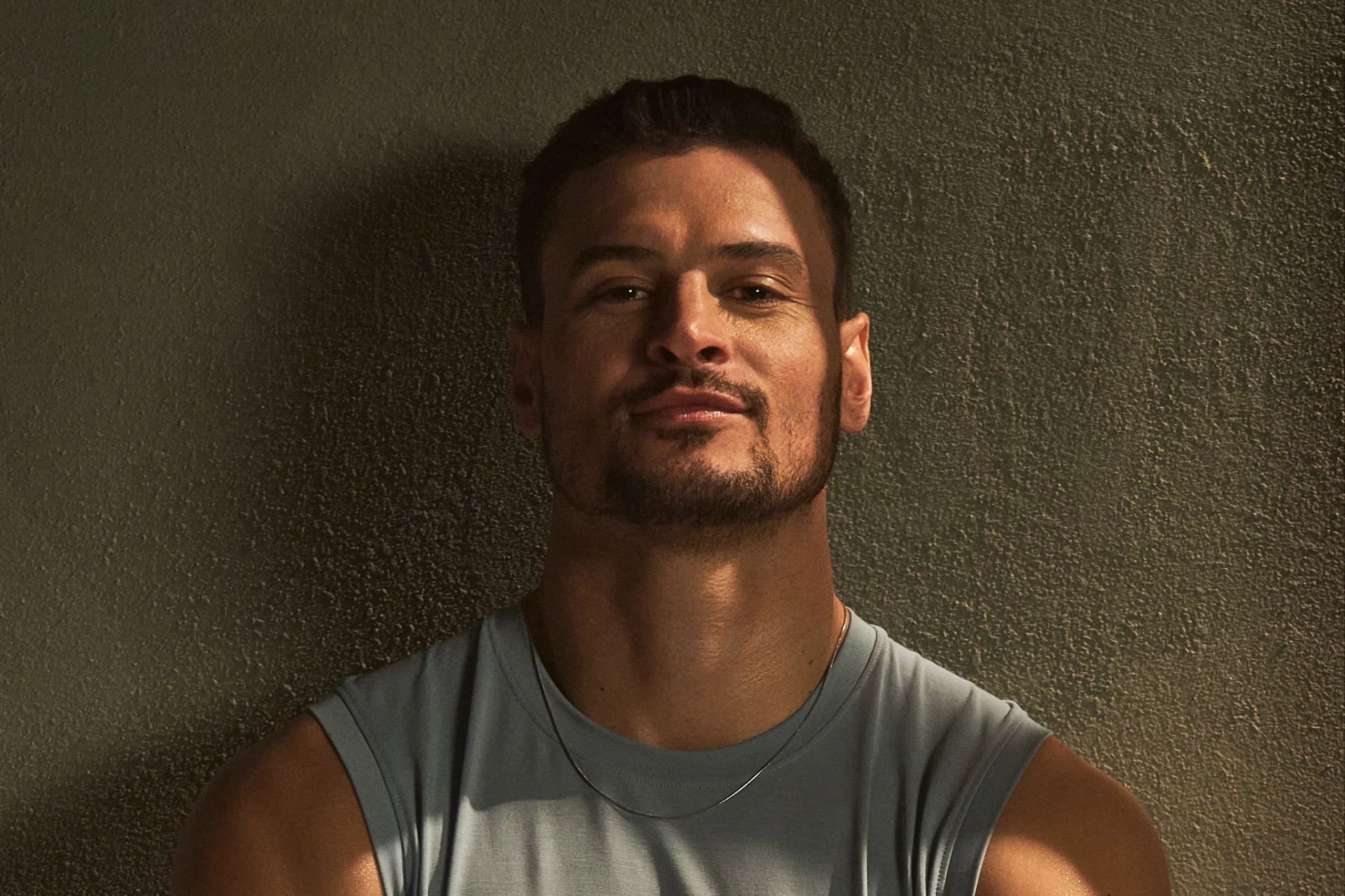 Man looks satisfied after a long gym session