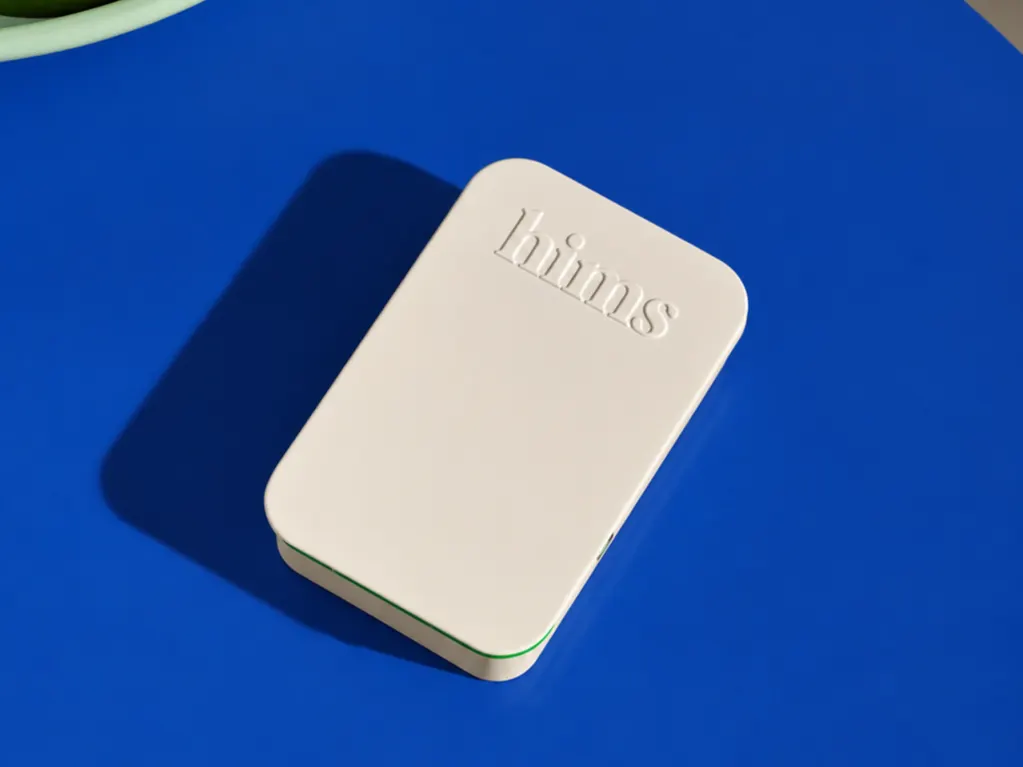 A Hims ED plan tin on a table