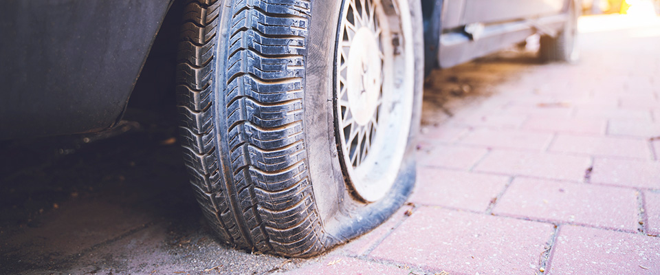 Car with a flat tyre