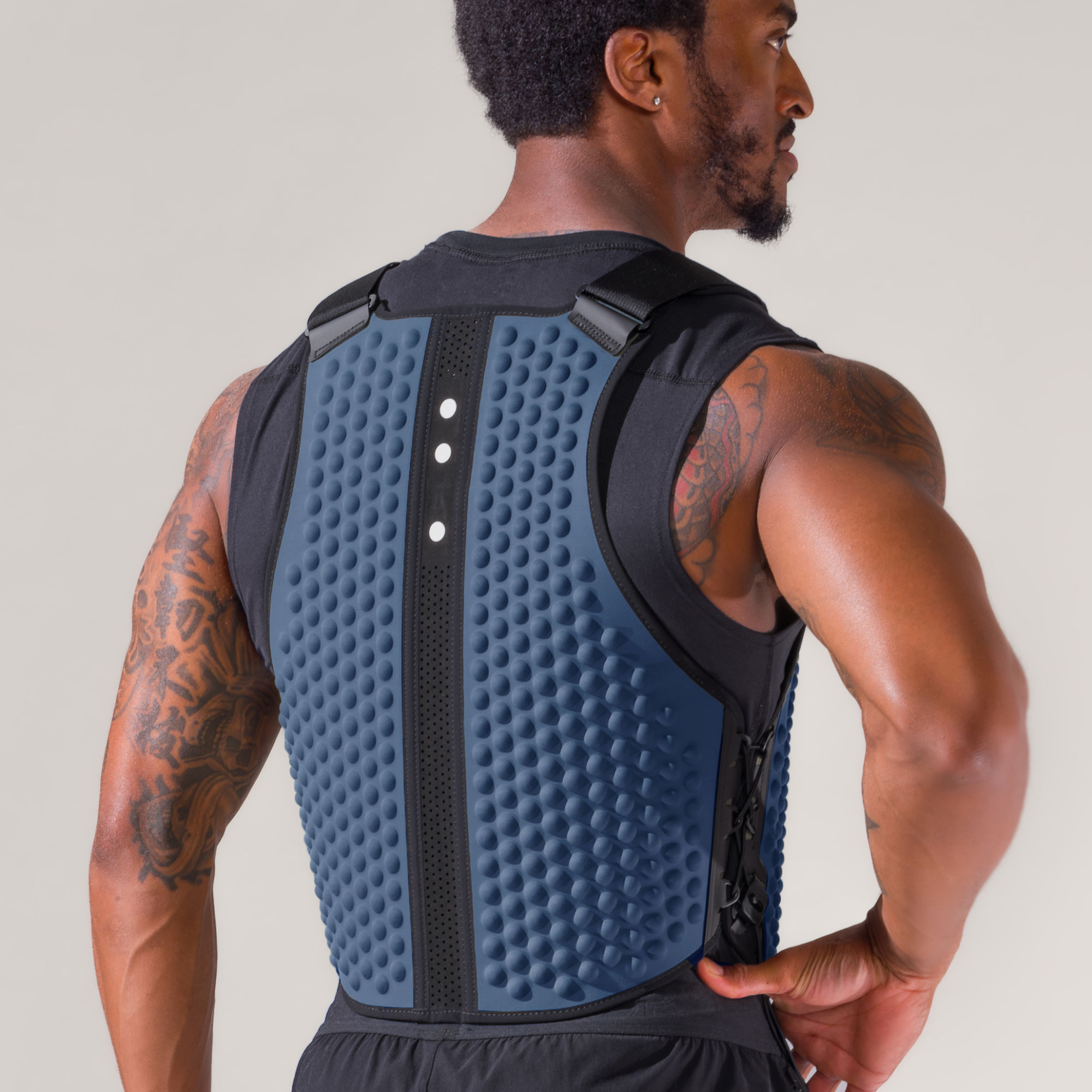Back view of man standing indoors in an Ocean blue G-Vest, weight vest for men