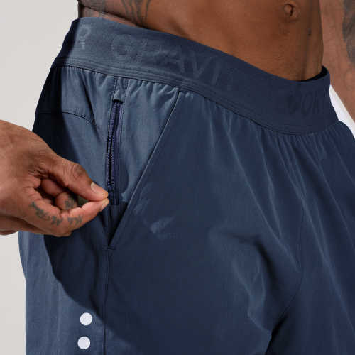 Zipper detail of OMORPHO weighted training shorts for men in Ocean blue.