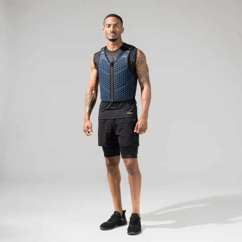 Full body view of a man standing in OMORPHO Ocean G-Vest weighted vest.