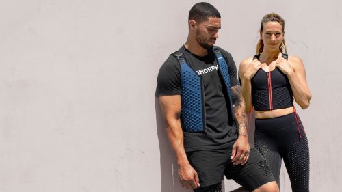 P1 Desktop - Man and woman in OMORPHO G-Vest Ocean and G-Vest Sport weighted workout vests