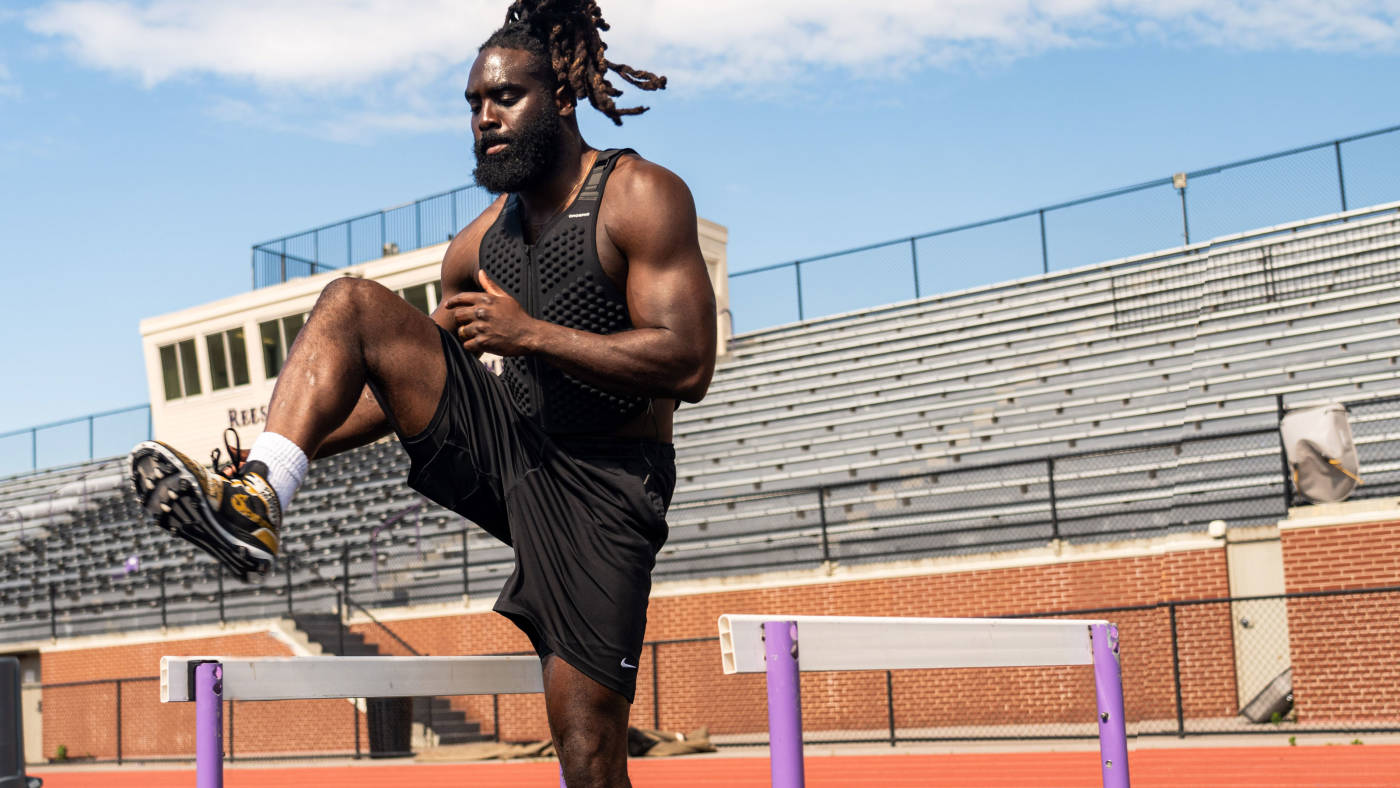 Demario Davis doing side hurdles wearing OMORPHO weighted tights for men and g-vest