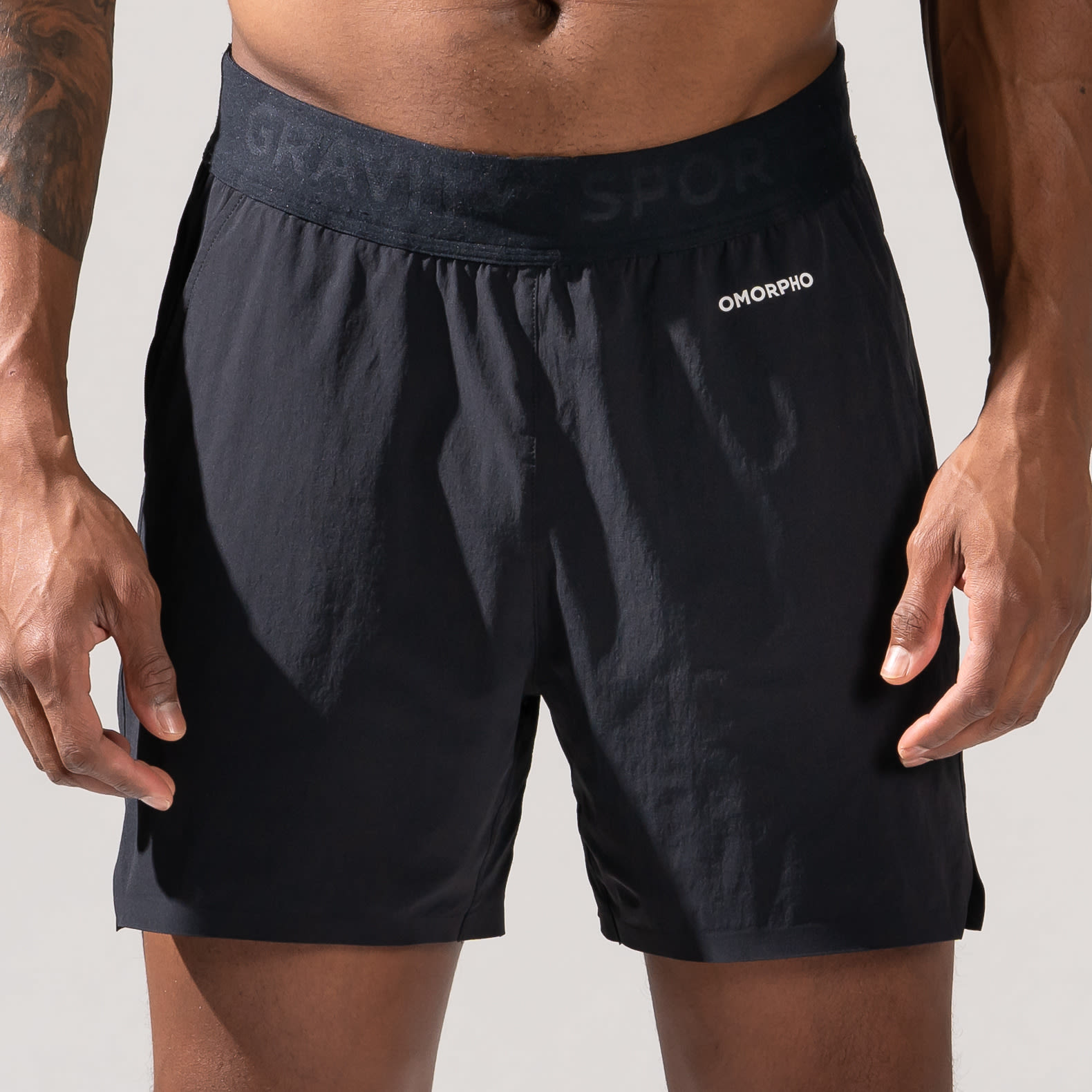 Close-up Front view of Male wearing OMORPHO Black O-Short gym shorts