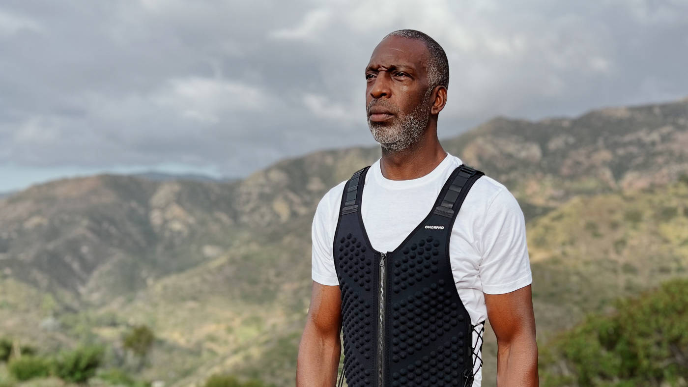 Michael Johnson wears a Black OMORPHO weighted G-Vest for men