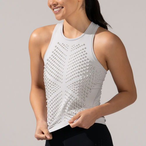 Crop torso view of a female smiling in the OMORPHO G-Tank Cloud weighted tank top for women
