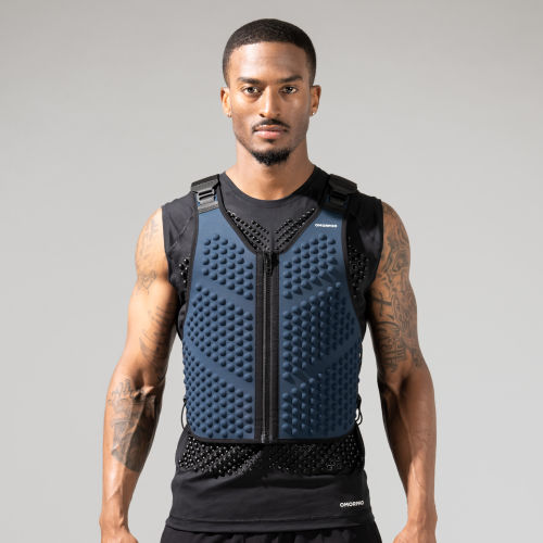 Front view of man wearing the OMORPHO Navy Blue G-Vest weighted vest.