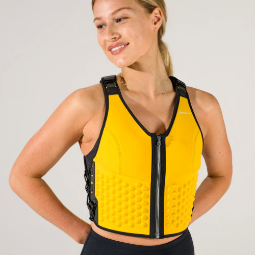 Front view of a woman in the yellow sun G-vest weighted workout vest for women