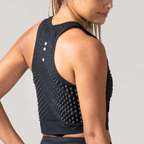 Back view of woman in the OMORPHO Black G-Crop  