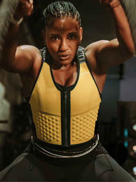 Collection - Desktop - woman does battle ropes in OMORPHO Sun G-Vest weight vest for women