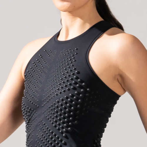 Close-up side view of a female wearing a Black weighted G-Tank top from OMORPHO