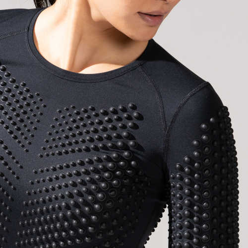 Close-up side view of Female wearing Omorpho black G Top Long Sleeve